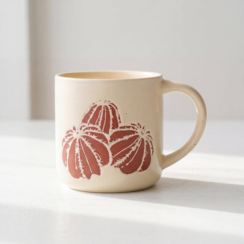 ROOT24STUDIO The Cactus Mug featuring raised terracotta barrel cactus relief on speckled ceramic