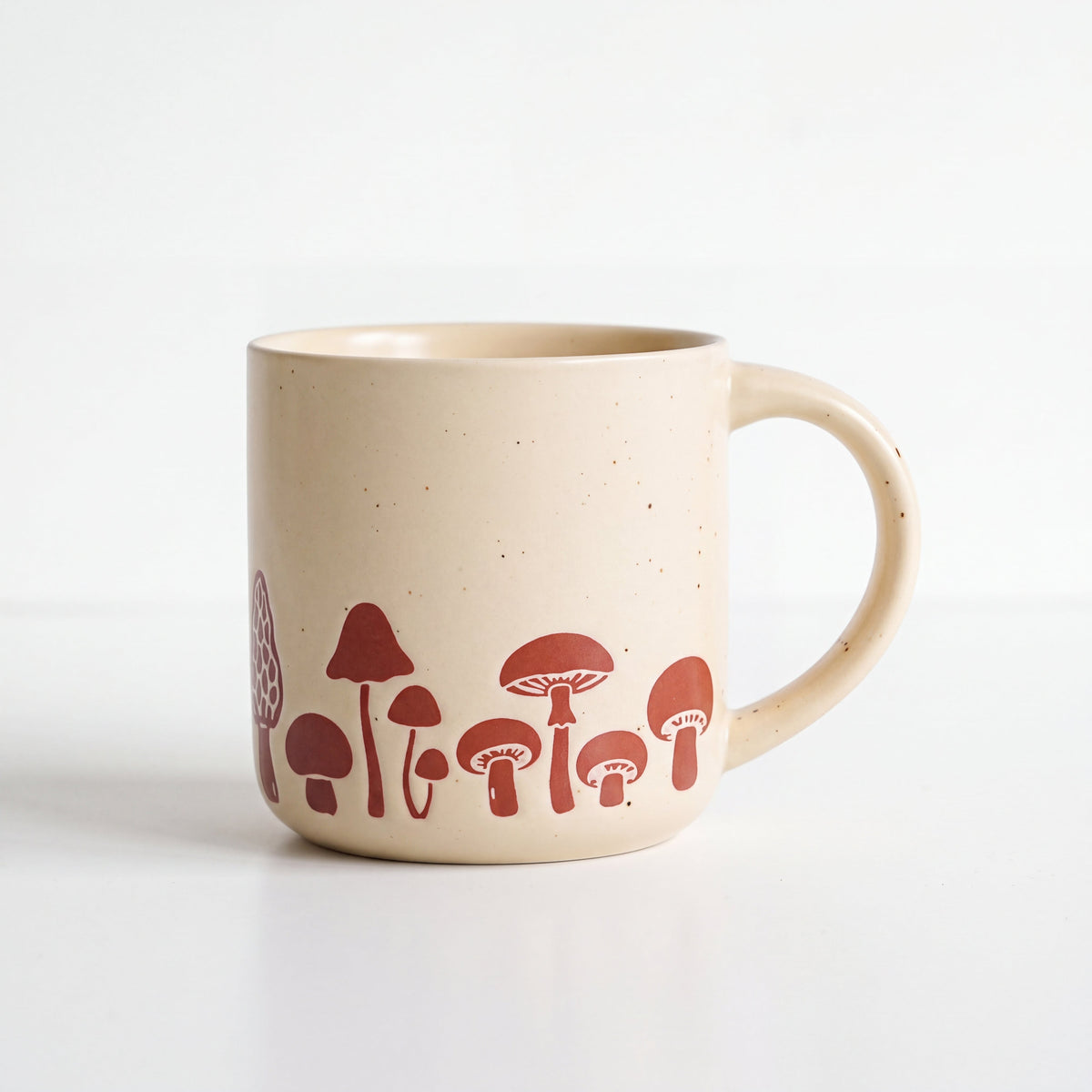 ROOT24STUDIO The Mushroom Mug featuring a panoramic terracotta wild mushroom motif with clean handle spacing