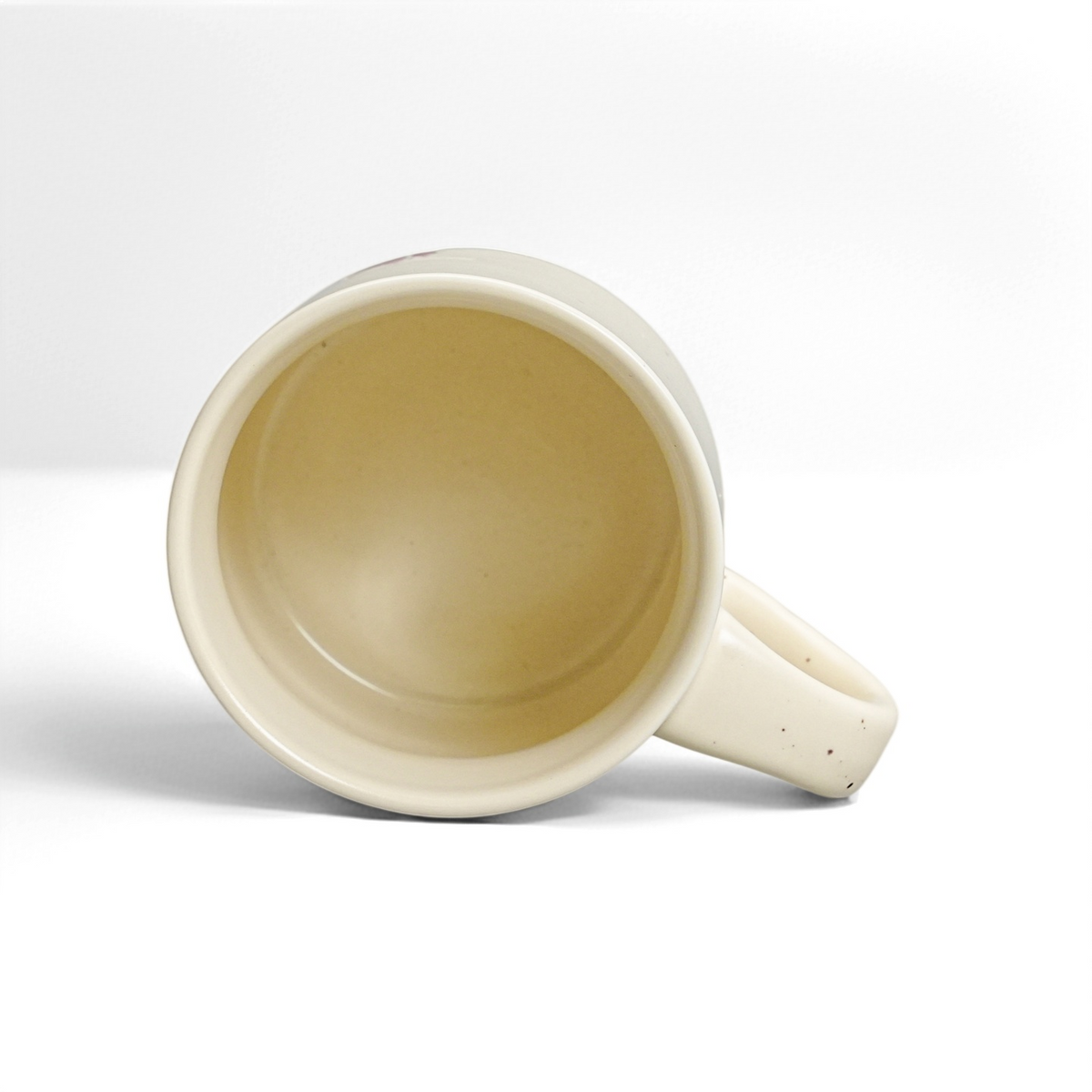 Top interior view of ROOT24STUDIO 12oz ceramic coffee mug showing glossy food-safe vanilla glaze