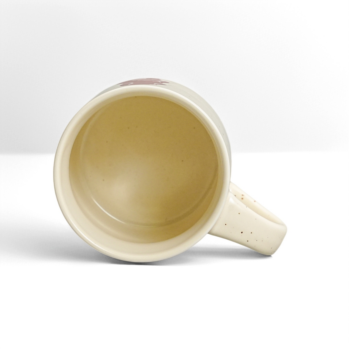 Top interior view of ROOT24STUDIO 12oz stoneware mug showing glossy food-safe vanilla glaze