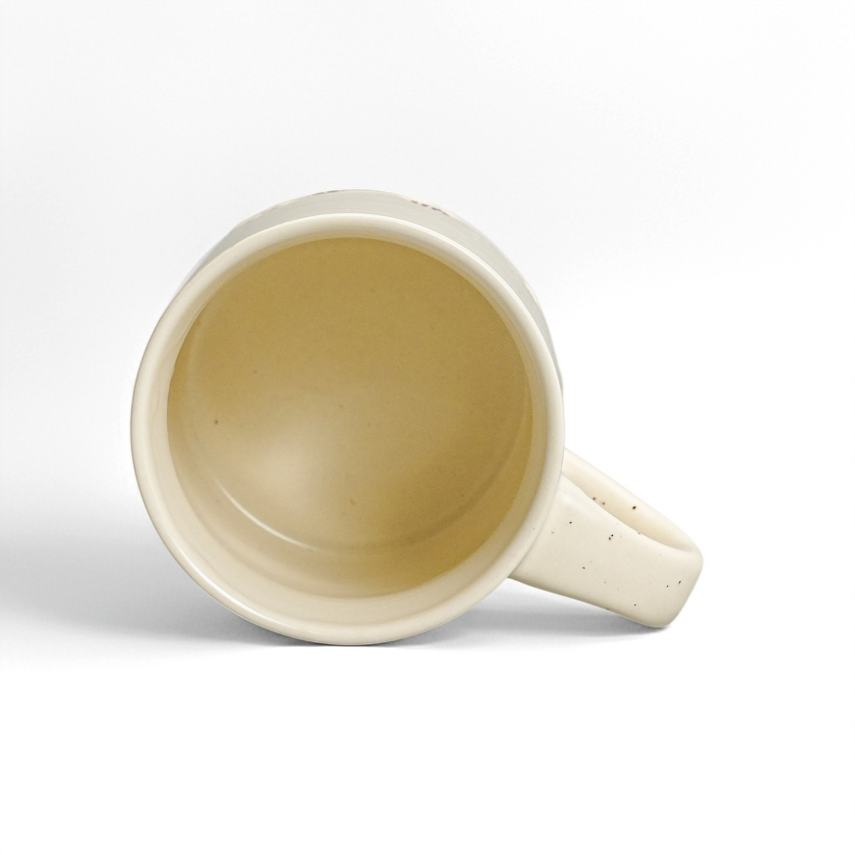 Top interior view of ROOT24STUDIO 12oz stoneware mug showing glossy food-safe vanilla ice glaze