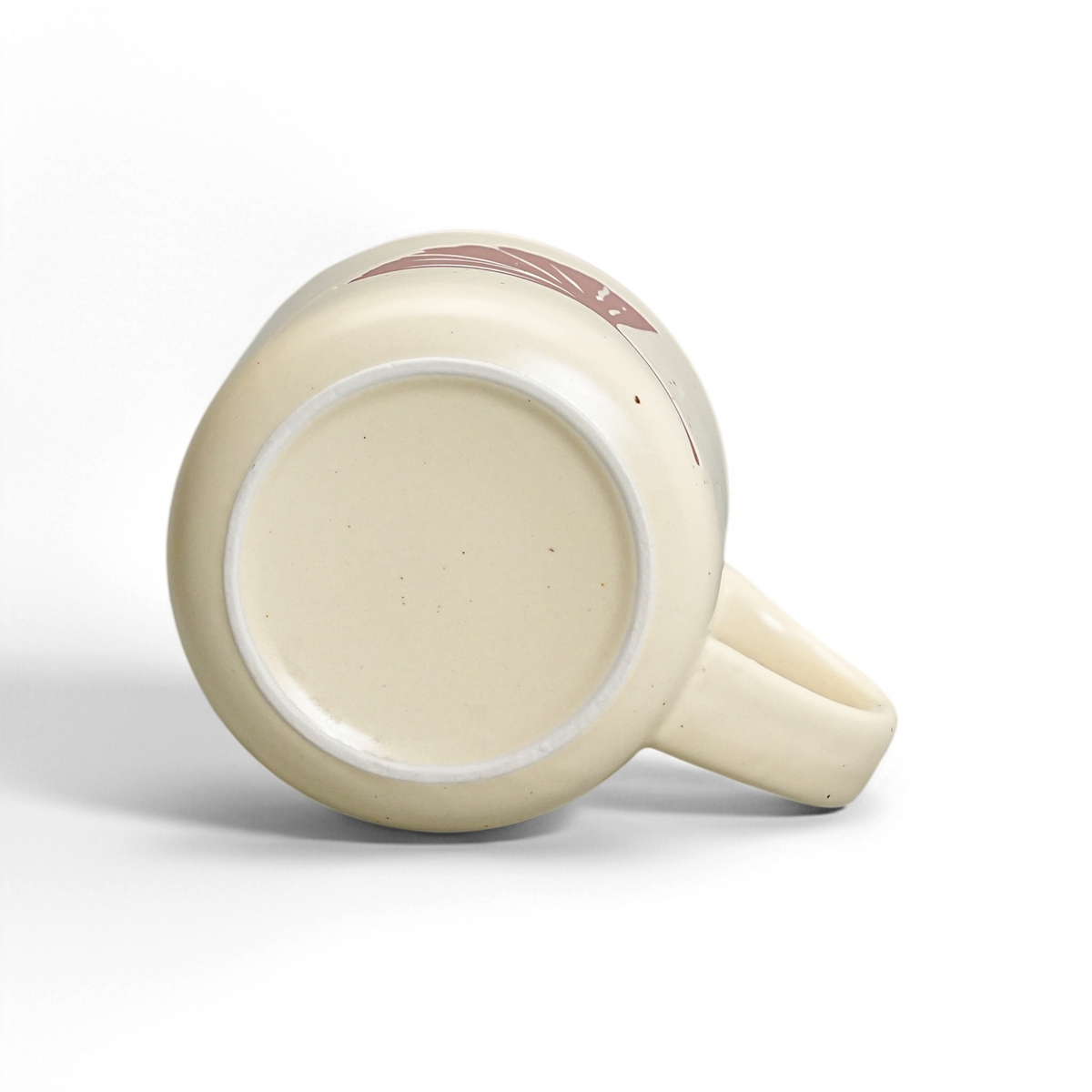 Unglazed raw stoneware foot ring and smooth ceramic base of The Ginkgo Mug by ROOT24STUDIO